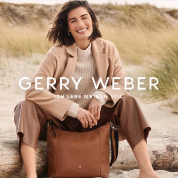 Gut gekleidete Frau am Strand mit Gerry Weber Tasche